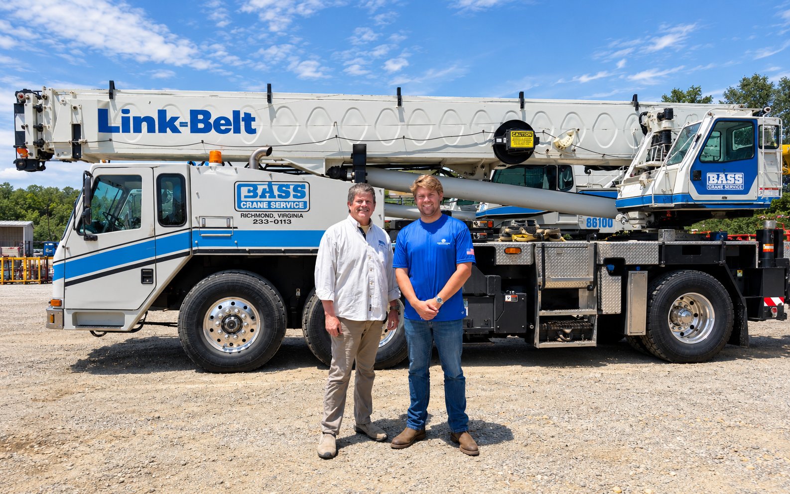 Bass Crane Service owners standing in front of a Link-Belt crane