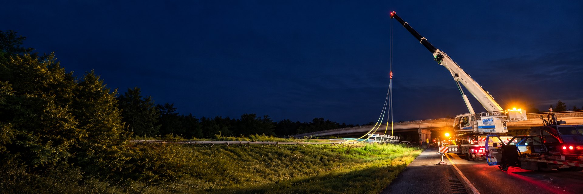 Bass Crane night lift beside a Virginia highway